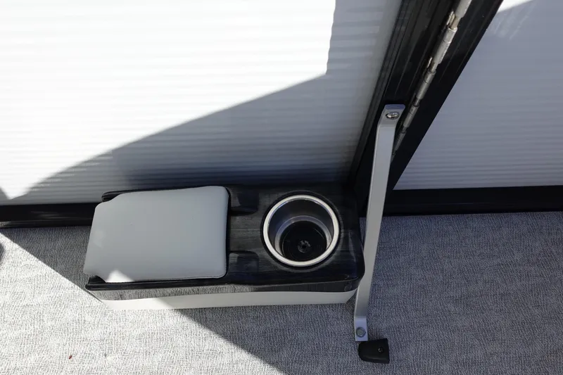 Slide: The Image of 2020 Tahoe Pontoon 2485 LTZ Rear Lounger cup holder and armrest detail. - 24