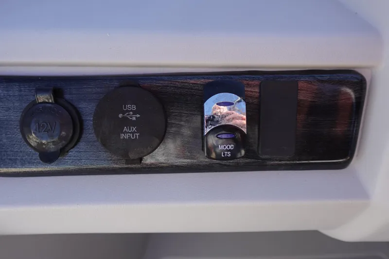 Slide: The Image of 2020 Tahoe Pontoon 2485 LTZ control panel with USB, 12V, and mood lights switch. - 27