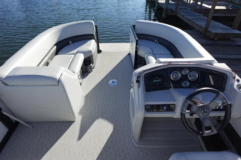 Slide: The Image of 2020 Tahoe Pontoon 2485 LTZ Rear Lounger with spacious seating and modern dashboard. - 3