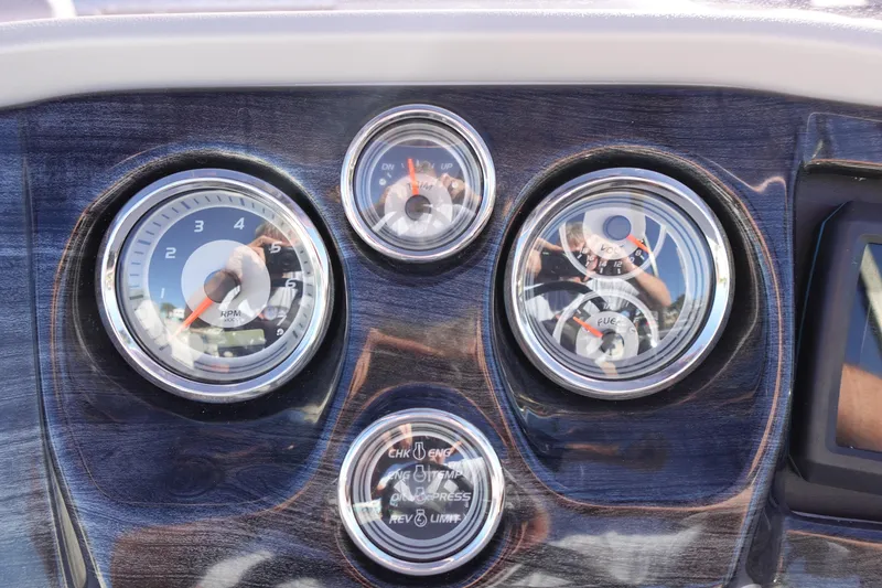 Slide: The Image of Dashboard gauges of 2020 Tahoe Pontoon 2485 LTZ Rear Lounger boat. - 30