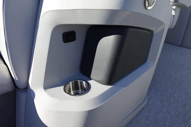 Slide: The Image of 2020 Tahoe Pontoon 2485 LTZ Rear Lounger cup holder and storage compartment detail. - 35