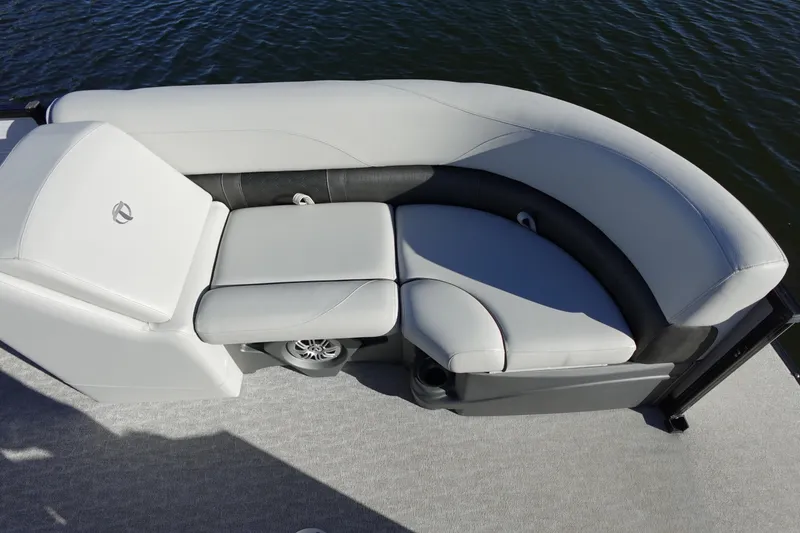 Slide: The Image of 2020 Tahoe Pontoon 2485 LTZ Rear Lounger with plush seating on calm water. - 39