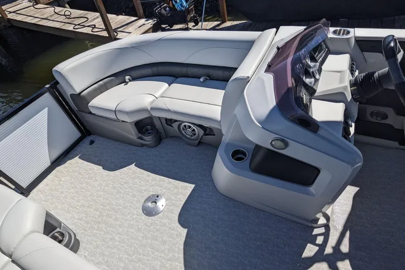 Slide: The Image of 2020 Tahoe Pontoon 2485 LTZ Rear Lounger interior with plush seating and modern dashboard. - 53