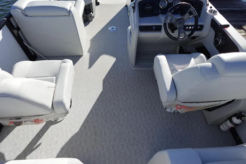 Slide: The Image of 2020 Tahoe Pontoon 2485 LTZ Rear Lounger interior with plush seating and modern dashboard. - 7