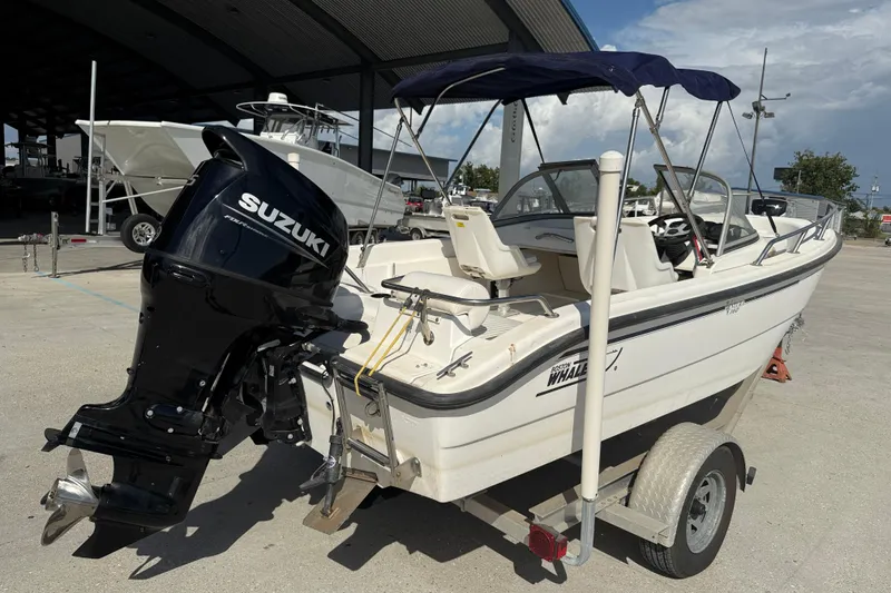 Slide: The Image of 2002 Boston Whaler Ventura 160 boat with Suzuki outboard motor on trailer. - 7