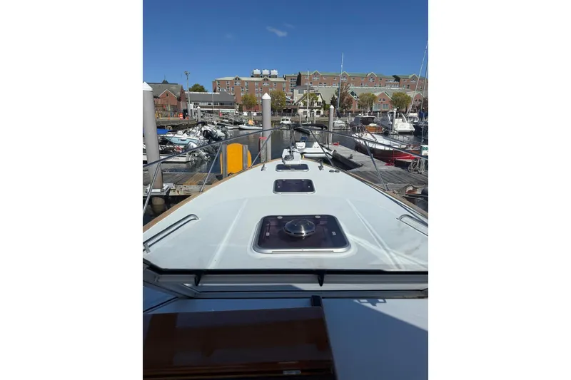 Slide: The Image of Little Harbor Whisper Jet 34, 2000 model, docked at a marina with clear blue sky. - 10