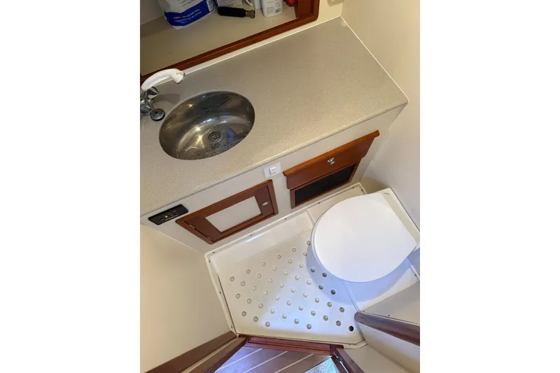 Slide: The Image of Little Harbor Whisper Jet 34 (2000) boat bathroom with sink and toilet. - 22