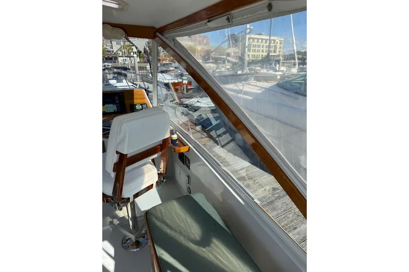 Slide: The Image of Interior view of 2000 Little Harbor Whisper Jet 34 boat, featuring helm and seating area. - 6