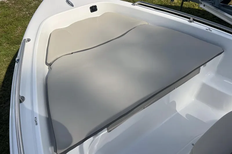 Slide: The Image of 2026 Key West 1720 Center Console boat with cushioned seating area. - 11