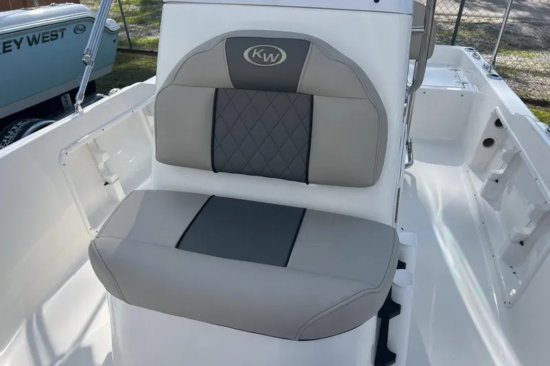 Slide: The Image of 2026 Key West 1720 Center Console boat seat with gray and black upholstery. - 12