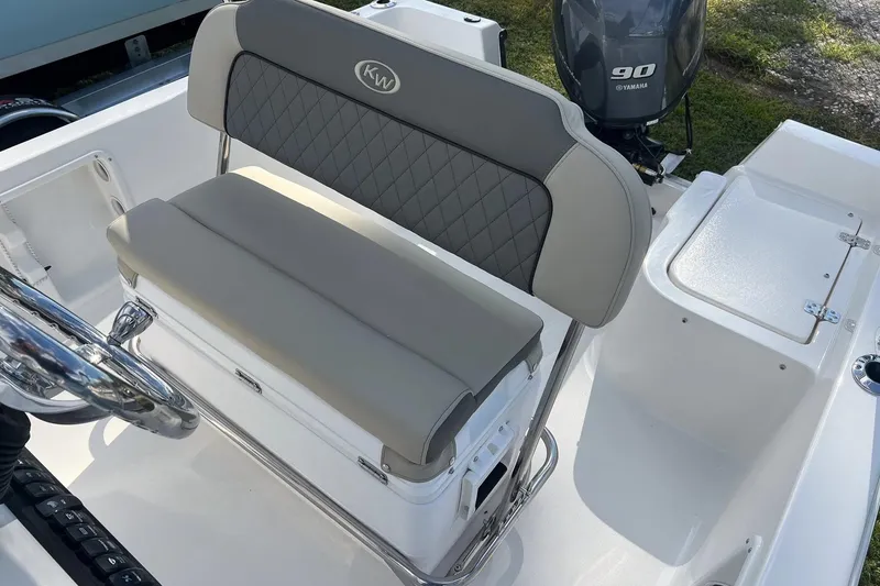 Slide: The Image of 2026 Key West 1720 Center Console boat interior with cushioned seating and Yamaha 90 engine. - 7