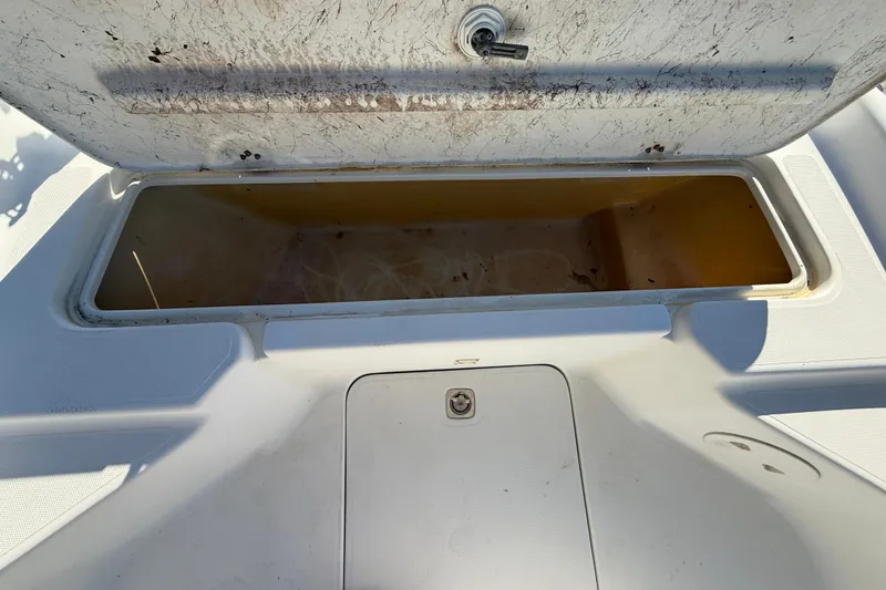 Slide: The Image of Open storage compartment on 2002 Fishmaster 196 Travis Edition boat. - 15