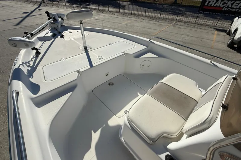 Slide: The Image of 2002 Fishmaster 196 Travis Edition boat interior with seating and trolling motor. - 9