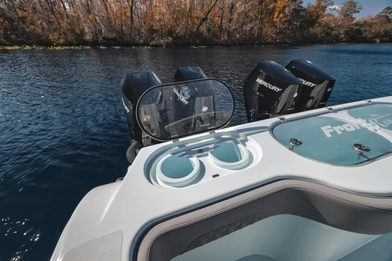 Slide: The Image of 2026 Front Runner 37' Catamaran with Mercury engines on a serene lake. - 14
