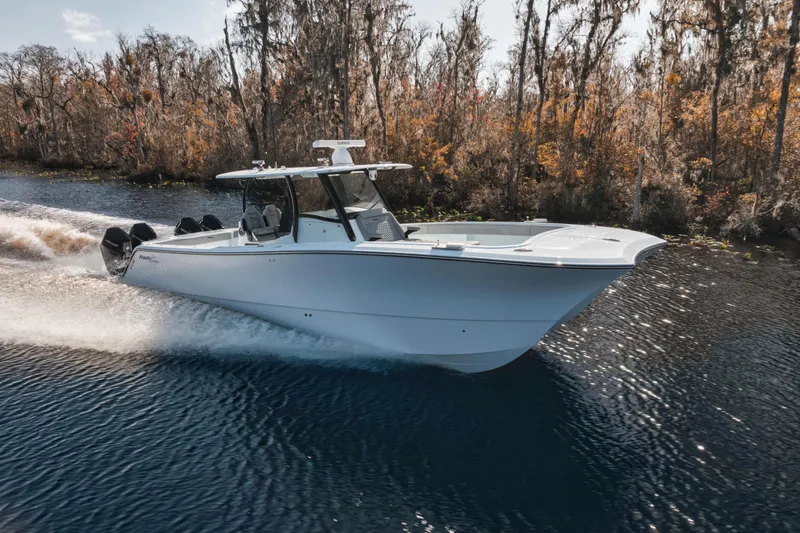 Slide: The Image of 2026 Front Runner 37' Catamaran cruising on a scenic waterway with autumn foliage. - 18