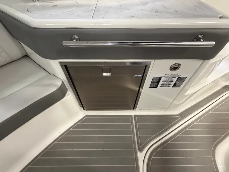 Slide: The Image of 2023 Sea Ray Sundancer 320 Outboard interior with sleek cabinetry and modern design. - 21