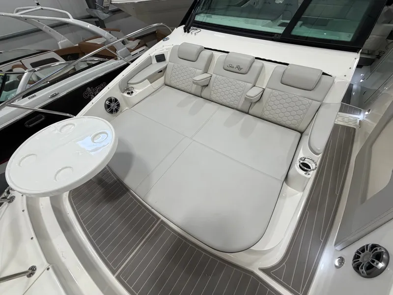 Slide: The Image of 2023 Sea Ray Sundancer 320 Outboard interior with luxurious seating and table. - 23