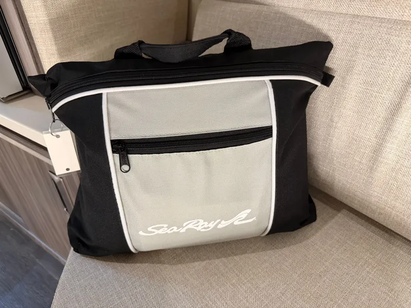 Slide: The Image of Black and gray Sea Ray bag on a beige seat, 2023 Sundancer 320 Outboard. - 31