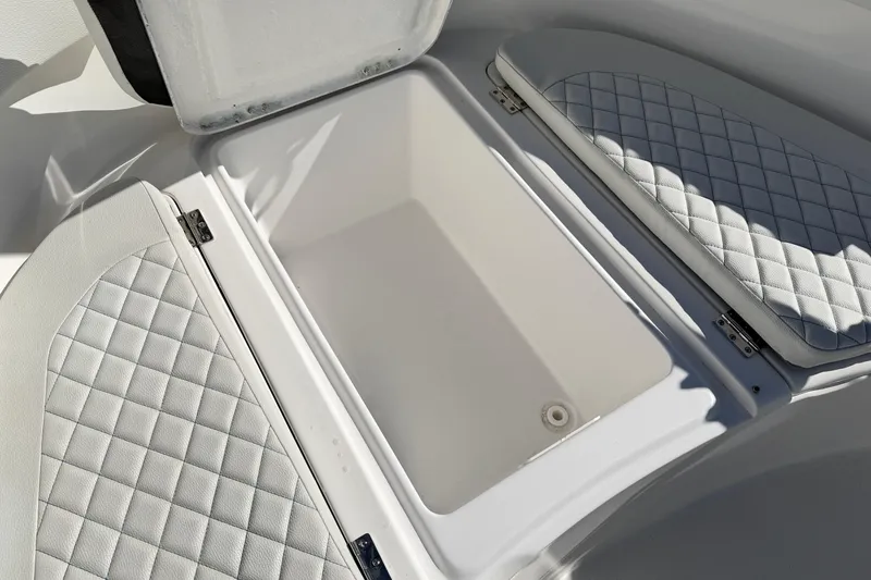 Slide: The Image of 2023 Clearwater 2200 CC boat storage compartment with quilted seating. - 19