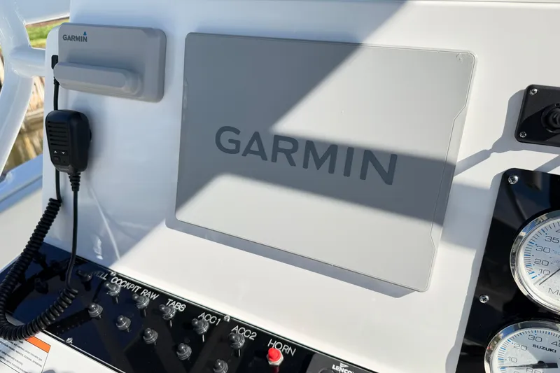 Slide: The Image of Control panel of 2023 Clearwater 2200 CC boat with Garmin navigation system. - 12