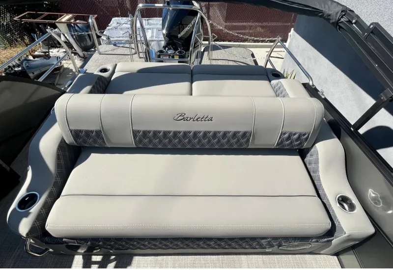 Slide: The Image of 2025 Barletta Lusso 23UC luxury boat seating with elegant upholstery and cup holders. - 14