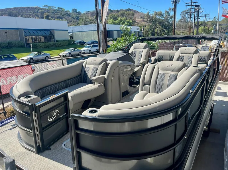 Slide: The Image of 2025 Barletta Lusso 23UC pontoon boat with luxurious seating and sleek design. - 19