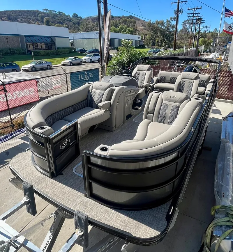 Slide: The Image of 2025 Barletta Lusso 23UC pontoon boat with luxurious seating and sleek design. - 21