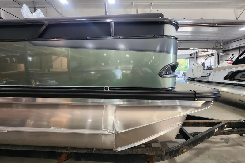 Slide: The Image of 2026 Avalon TRIPLETOON Venture CRB with Patio Pad in showroom, side view. - 10