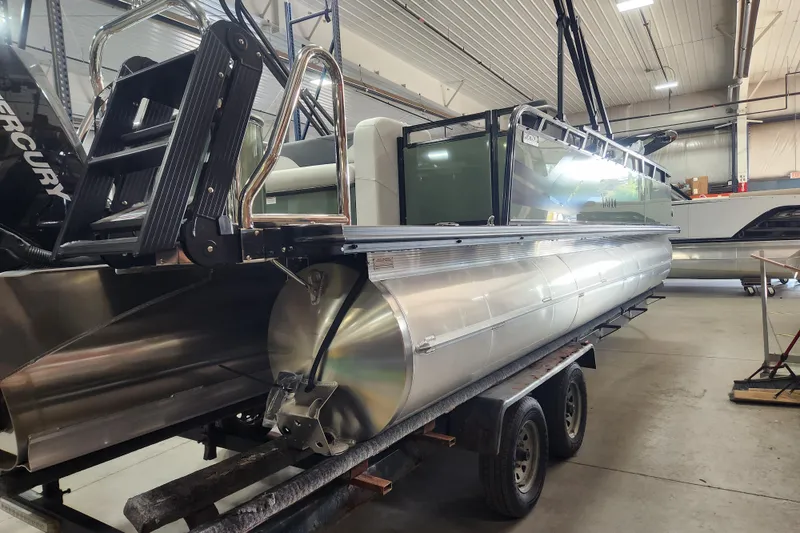 Slide: The Image of 2026 Avalon TRIPLETOON Venture CRB with Patio Pad in a workshop setting. - 11