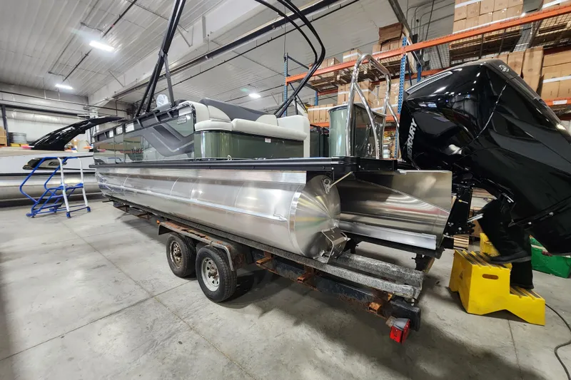 Slide: The Image of 2026 Avalon TRIPLETOON Venture CRB with Patio Pad in warehouse, on trailer. - 16