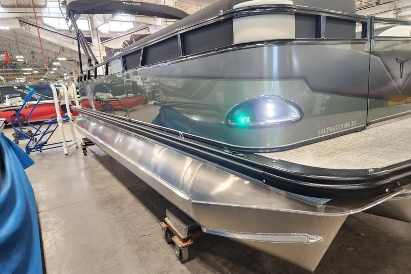 Slide: The Image of 2026 Avalon TRIPLETOON Venture CRB with Patio Pad, Saltwater Series pontoon boat in showroom. - 17