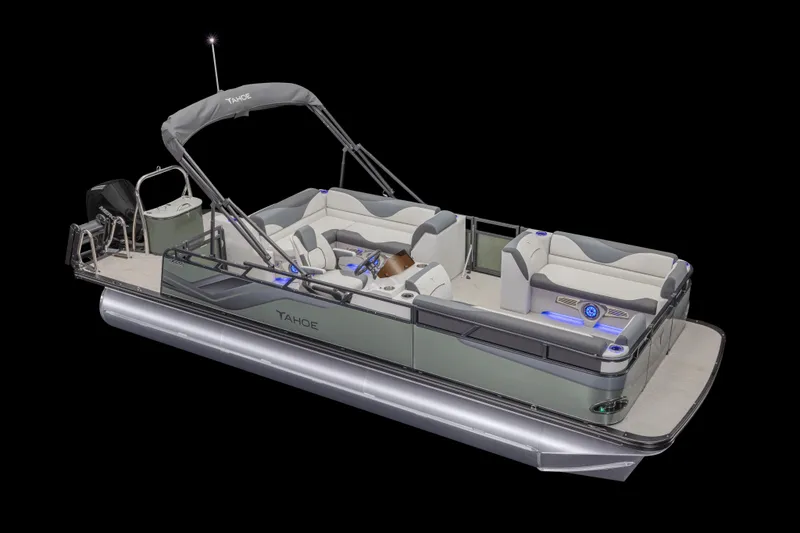Slide: The Image of 2026 Avalon TRIPLETOON Venture CRB with Patio Pad interior, showcasing seating and helm in a warehouse. - 2