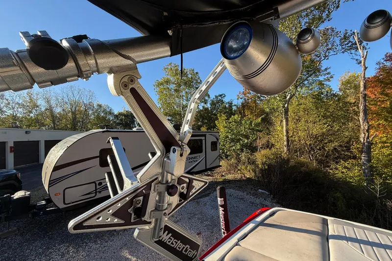 Slide: The Image of 2008 MasterCraft XStar 23 boat tower with speakers and wakeboard rack, outdoors. - 14
