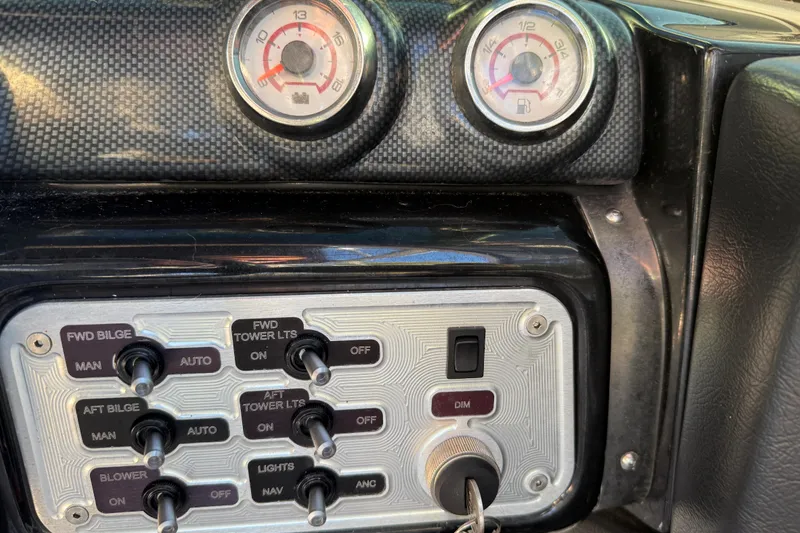 Slide: The Image of Control panel of a 2008 MasterCraft XStar 23 boat with gauges and switches. - 22