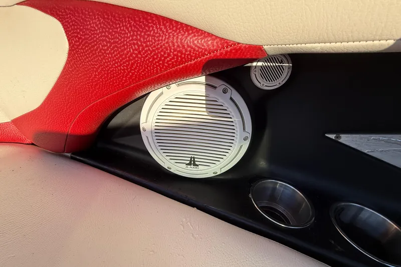 Slide: The Image of Interior of 2008 MasterCraft XStar 23 featuring JL Audio speaker and cup holders. - 24