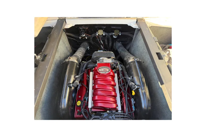 Slide: The Image of 2008 MasterCraft XStar 23 engine compartment with red MCX engine. - 25