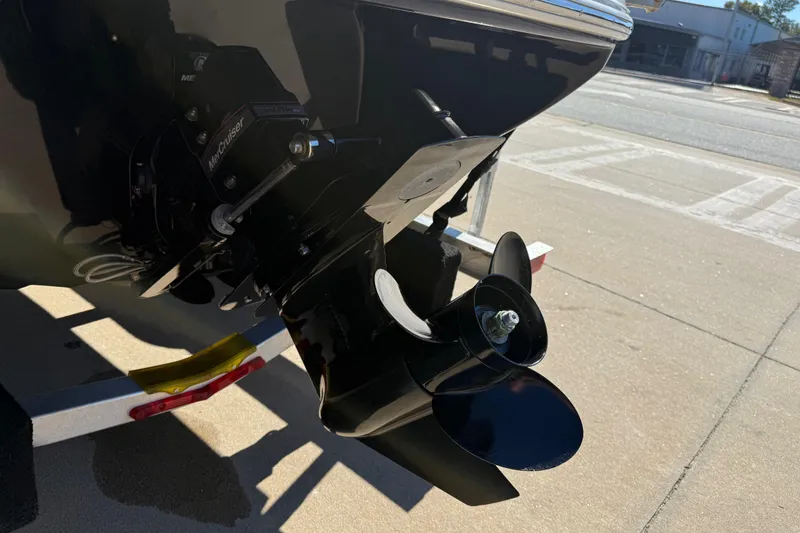 Slide: The Image of 2019 Stingray 198 LX boat propeller and outdrive on a trailer. - 10