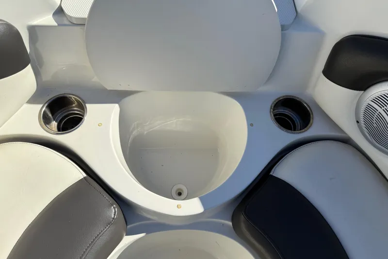 Slide: The Image of 2019 Stingray 198 LX boat interior with cup holders and seating. - 14