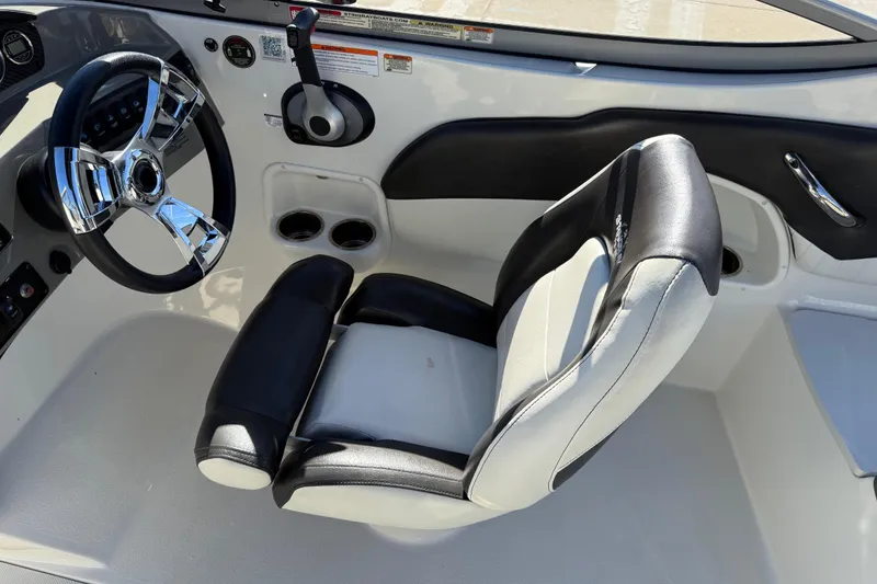 Slide: The Image of Interior of 2019 Stingray 198 LX boat with steering wheel and captain's seat. - 21