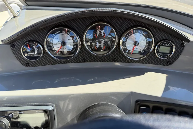 Slide: The Image of Dashboard of a 2019 Stingray 198 LX boat with speedometer and gauges. - 24