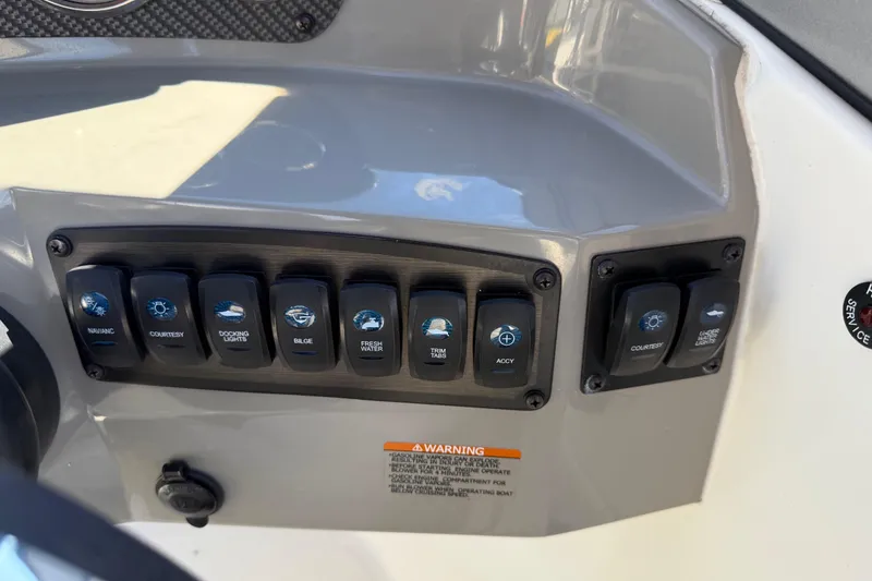Slide: The Image of Control panel of a 2019 Stingray 198 LX boat with labeled switches. - 25