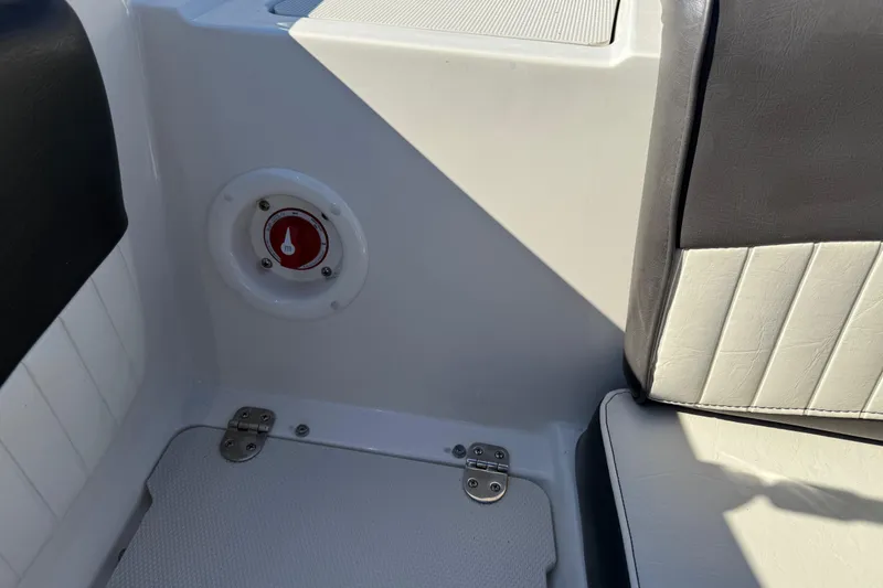 Slide: The Image of Interior of 2019 Stingray 198 LX boat showing seating and compartment details. - 29