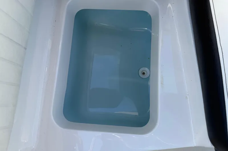 Slide: The Image of 2019 Stingray 198 LX boat livewell filled with water. - 30