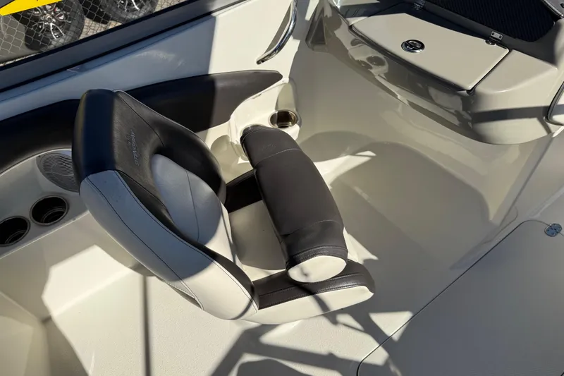 Slide: The Image of 2019 Stingray 198 LX boat interior with black and white seating. - 37