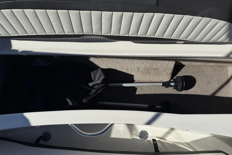 Slide: The Image of 2019 Stingray 198 LX boat interior storage compartment with equipment and upholstery. - 39