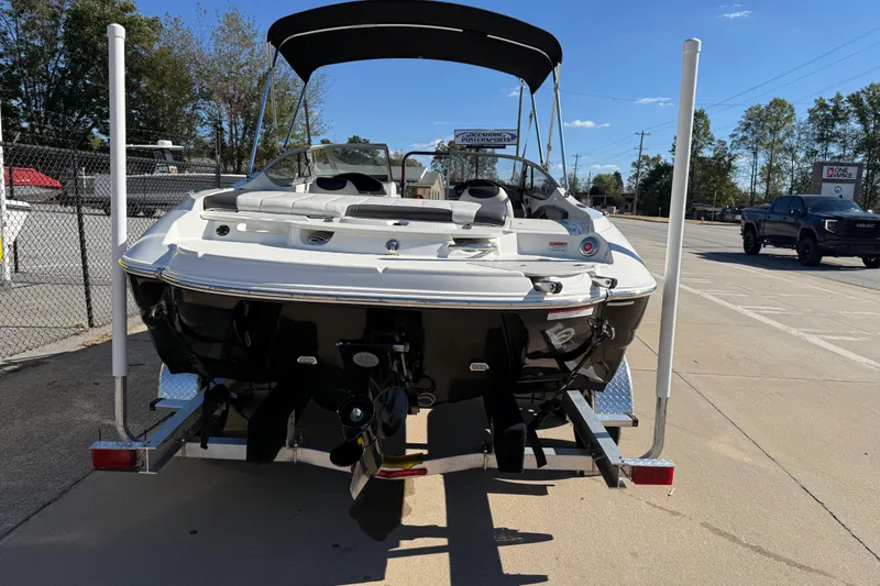 Slide: The Image of 2019 Stingray 198 LX boat on trailer, rear view, sunny day. - 4