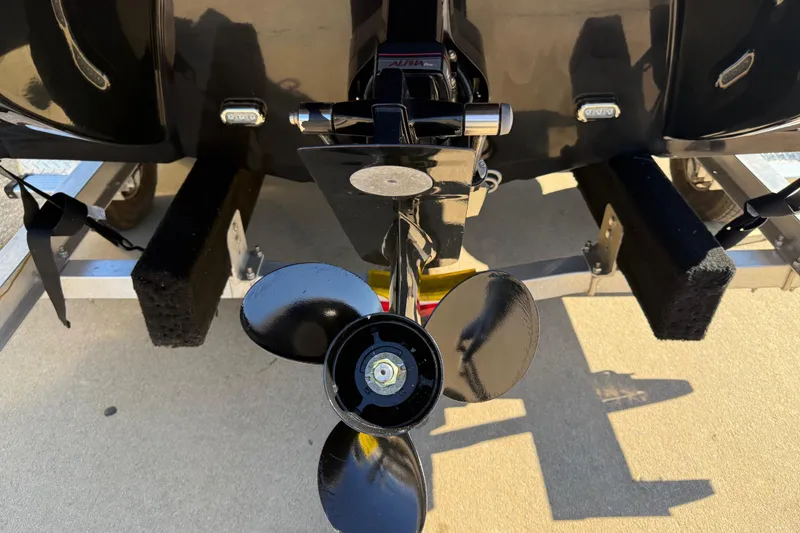 Slide: The Image of Rear view of 2019 Stingray 198 LX boat propeller on trailer. - 9