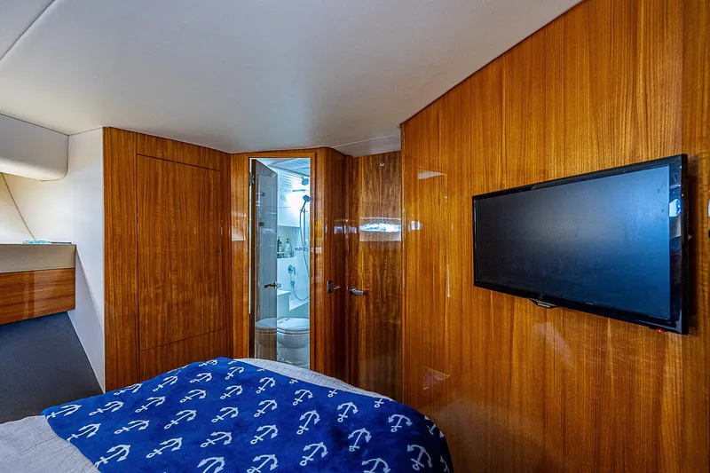 Slide: The Image of Interior of 2014 Maritimo 470 Offshore Convertible yacht with modern furnishings. - 14