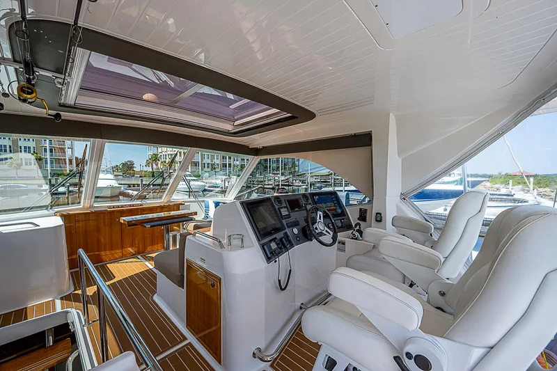 Slide: The Image of Modern bathroom in 2014 Maritimo 470 Offshore Convertible yacht, featuring shower and vanity. - 20