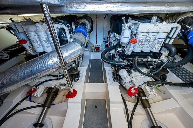 Slide: The Image of 2014 Maritimo 470 Offshore Convertible yacht bedroom with wooden paneling and TV. - 22